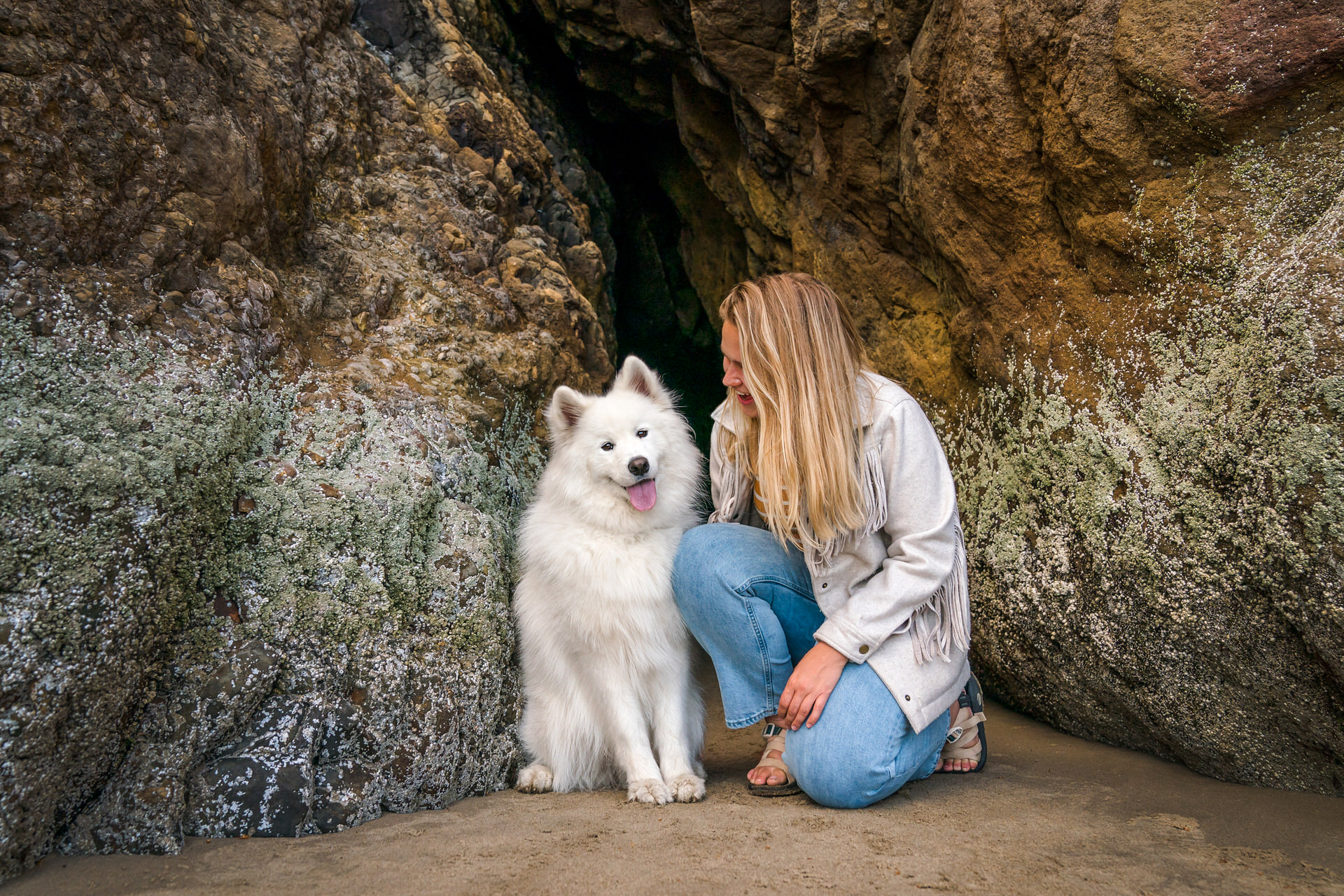 dog and woman at an oregon beach