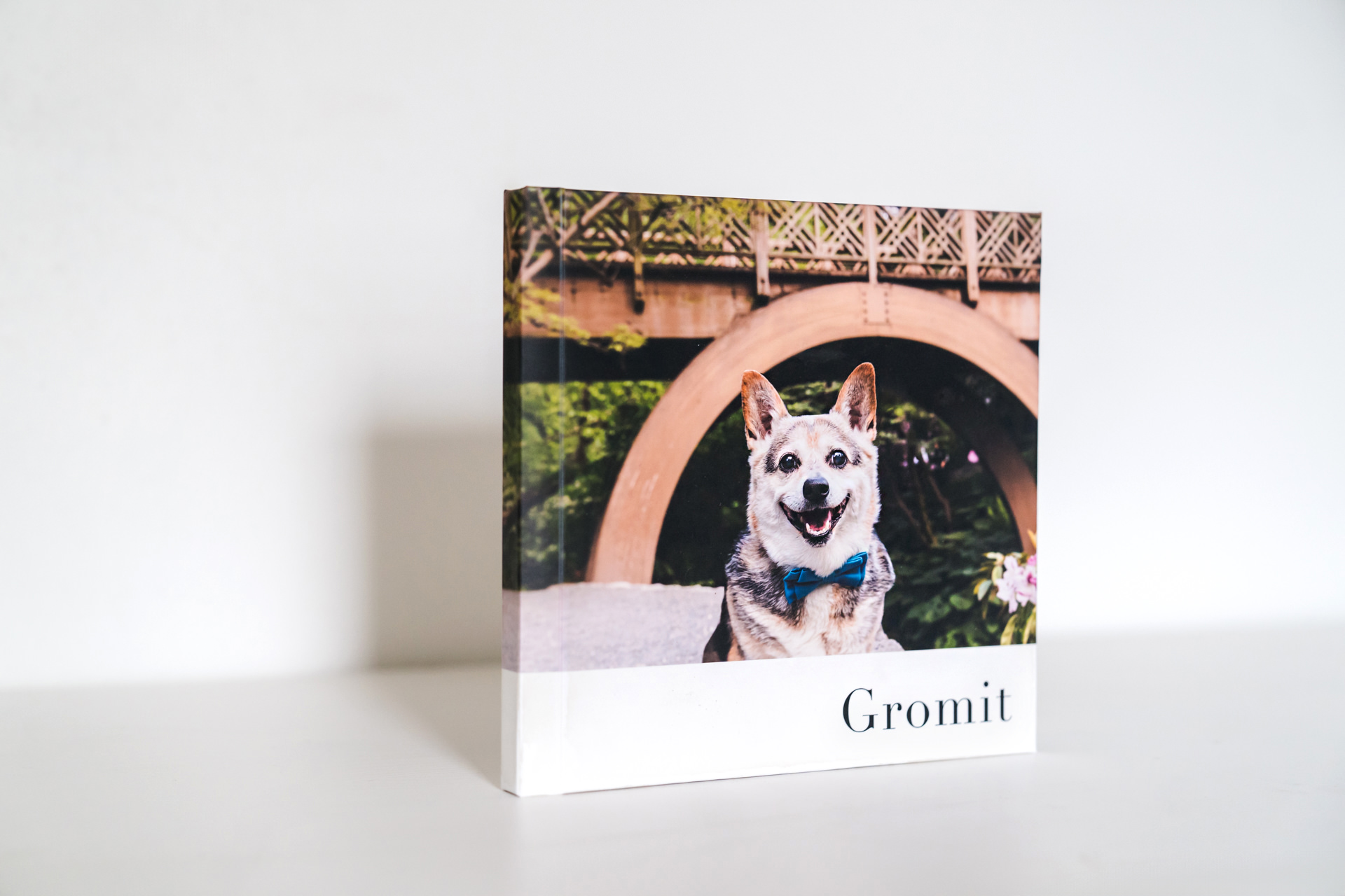 Printed photo book featuring smiling dog named Gromit.